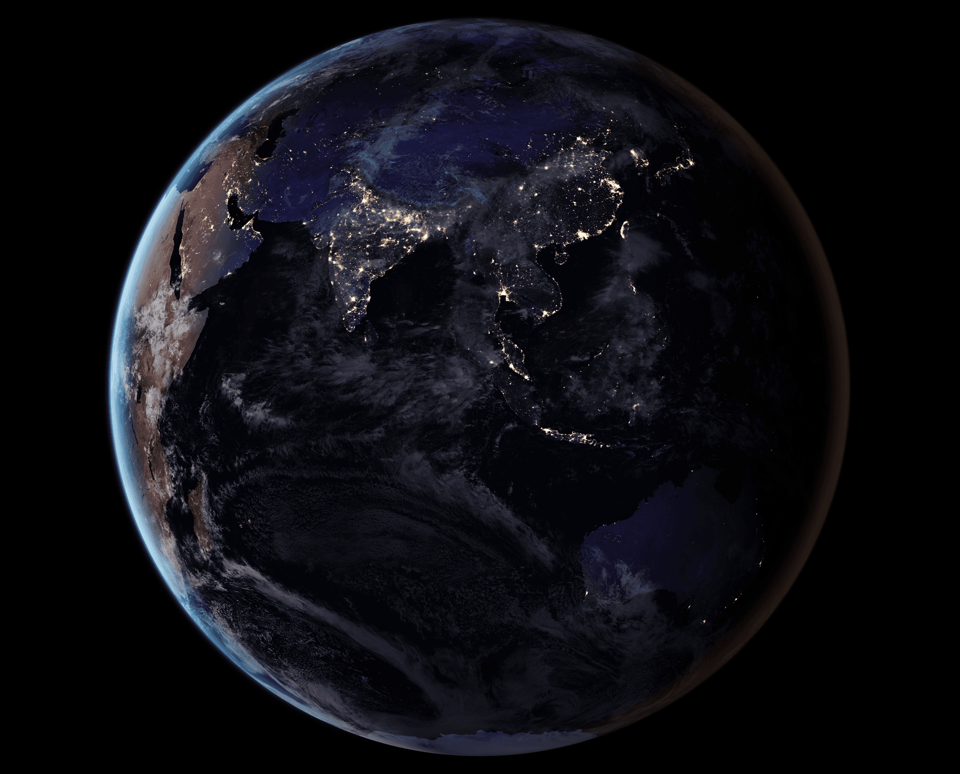 Satellite view at night of Asia and the Middle East showing city lights, from NASA Earth Observatory.